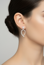 Load image into Gallery viewer, Diamond pear shape earrings on dark hair mode