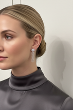 Load image into Gallery viewer, Cascading diamond floral earrings on model - correct proportions