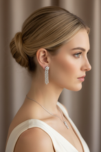 Load image into Gallery viewer, Cascading diamond floral earrings on model - variation