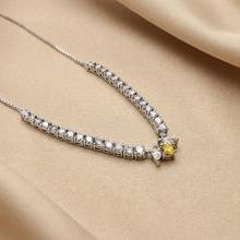 Load image into Gallery viewer, Diamond and yellow sapphire necklace on champagne satin
