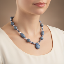 Load image into Gallery viewer, Blue sponge coral necklace worn on model