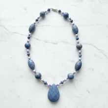 Load image into Gallery viewer, Blue sponge coral necklace on white marble