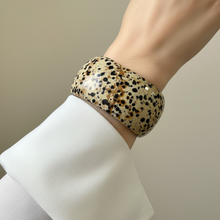 Load image into Gallery viewer, Dalmatian jasper cuff bracelet on model wrist