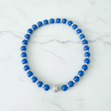 Load image into Gallery viewer, Blue jade necklace on white marble