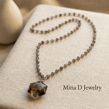 Load image into Gallery viewer, Smoky quartz and labradorite necklace styled on warm linen