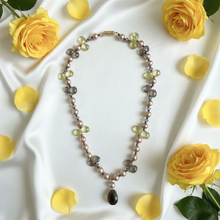Load image into Gallery viewer, Smoky quartz pearl necklace flat lay with silk and yellow roses