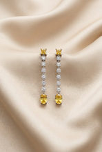Load image into Gallery viewer, Yellow sapphire earrings on smooth champagne satin