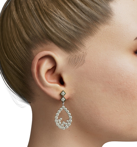 Diamond dangling earrings on maniquin