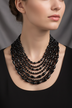 Load image into Gallery viewer, Black multi-strand necklace on model
