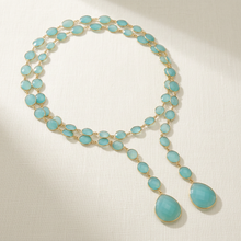 Load image into Gallery viewer, Chalcedony lariat arranged in a loose oval flat lay
