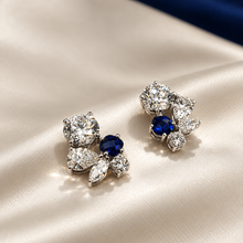 Load image into Gallery viewer, Editorial image of diamond and sapphire cluster earrings
