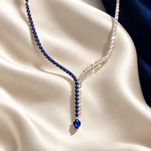 Load image into Gallery viewer, Editorial image of sapphire and diamond lariat necklace

