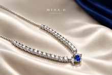 Load image into Gallery viewer, Editorial image of the marquise diamond tennis necklace with blue sapphires
