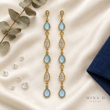 Load image into Gallery viewer, Flat lay of blue agate and CZ dangling earrings
