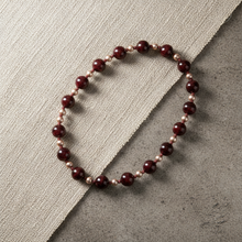 Load image into Gallery viewer, Flat lay of burgundy bead necklace

