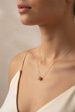 Load image into Gallery viewer, Model wearing pavé ball pendant necklace in yellow gold
