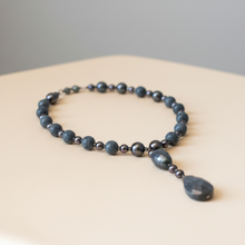 Load image into Gallery viewer, Blue sponge coral necklace on warm cream background
