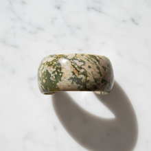 Load image into Gallery viewer, Natural stone cuff bracelet flat lay on marble

