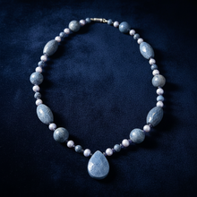 Load image into Gallery viewer, Blue sponge coral necklace on dark velvet
