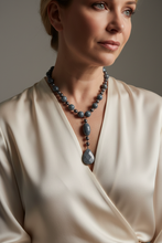 Load image into Gallery viewer, Elegant model wearing blue sponge coral necklace
