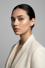 Load image into Gallery viewer, Model wearing diamond cluster stud earrings, light background
