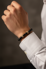Load image into Gallery viewer, Men's Black Onyx Gold Barrel Bracelet Model

