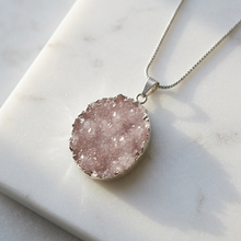 Load image into Gallery viewer, Pink druzy necklace editorial detail on white marble
