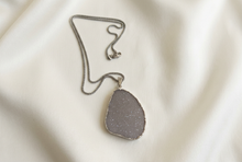 Load image into Gallery viewer, Silver druzy necklace on ivory satin
